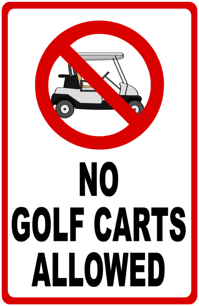 a street sign stating "no golf carts allowed"